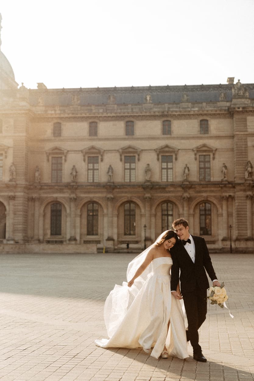 Paris elopement photographer couple walking at Louvre