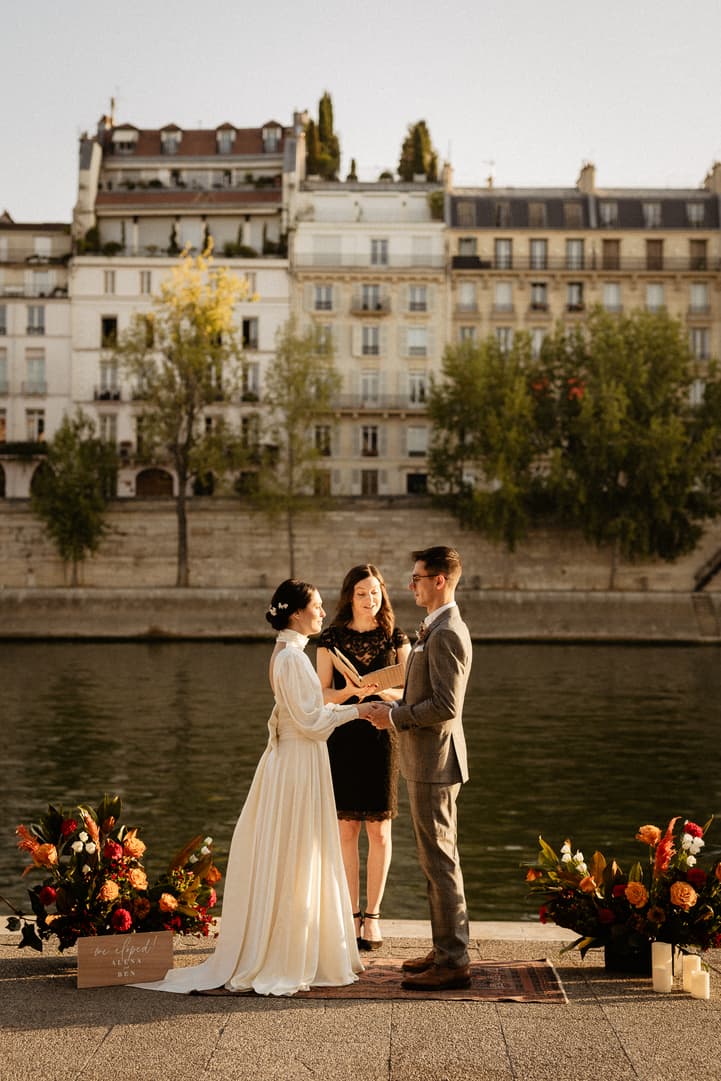 Elopement by the seine with flowers and officiant