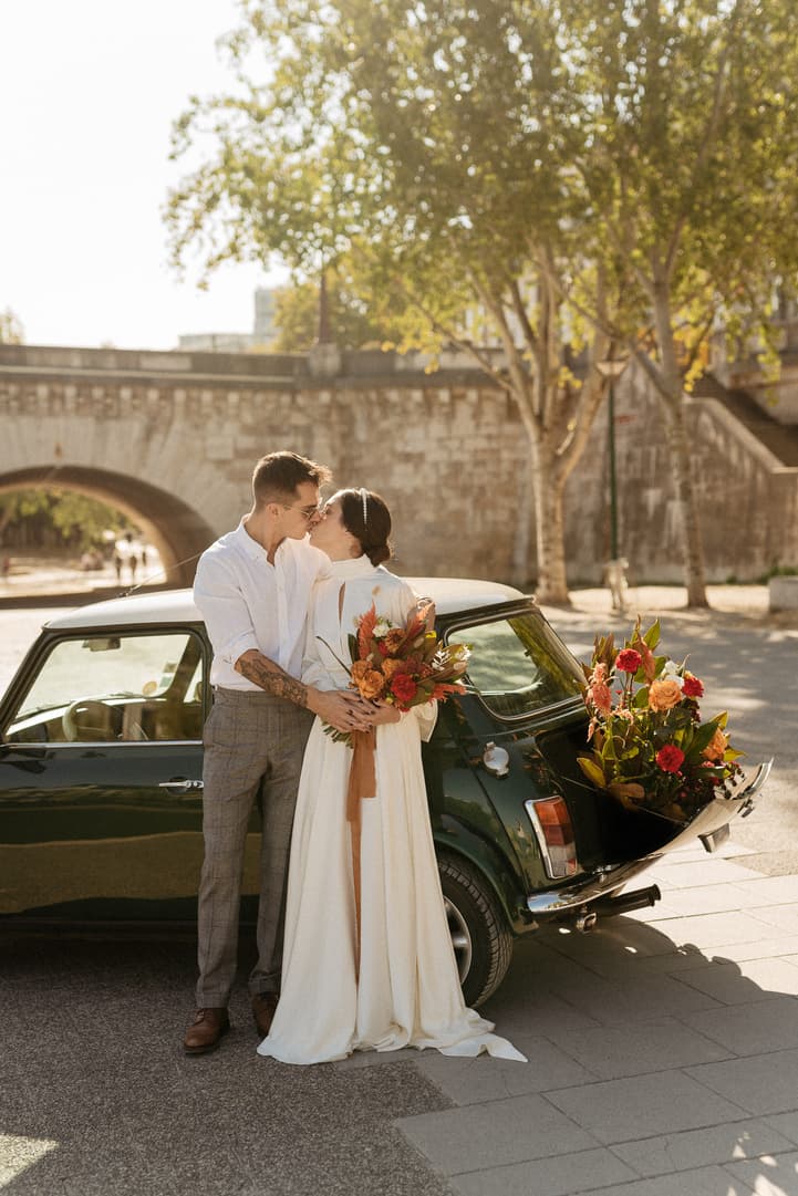 couple wedding portraits by vintage car