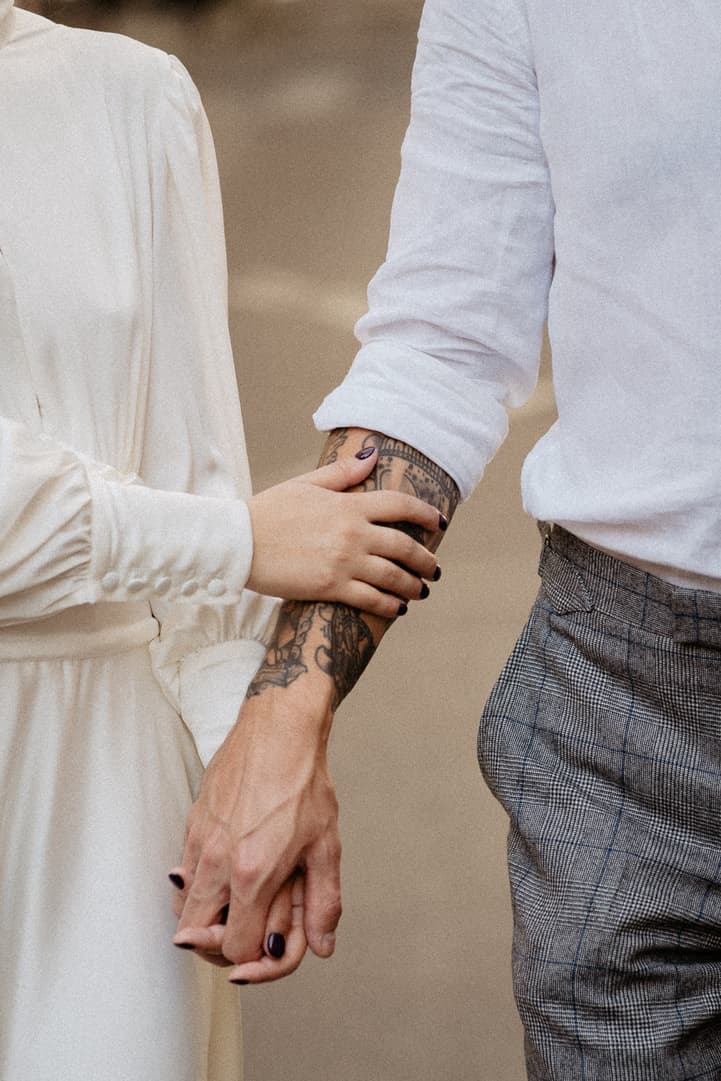 Couple holding hands