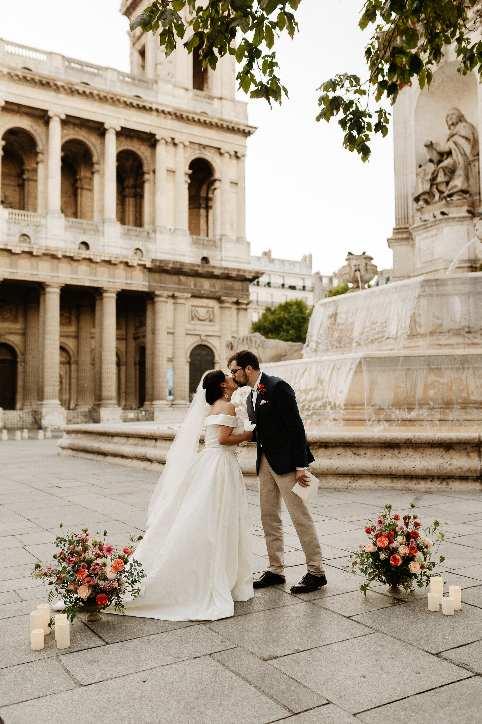 Haruka and Florent kissing by the fountain of Saint-Sulpice after their vows
