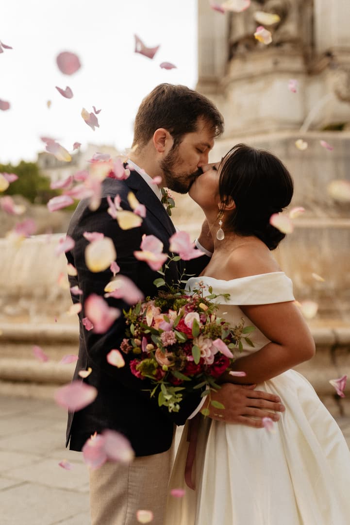 Florent kissing Haruka as rose petals fall around them at Saint-Sulpice