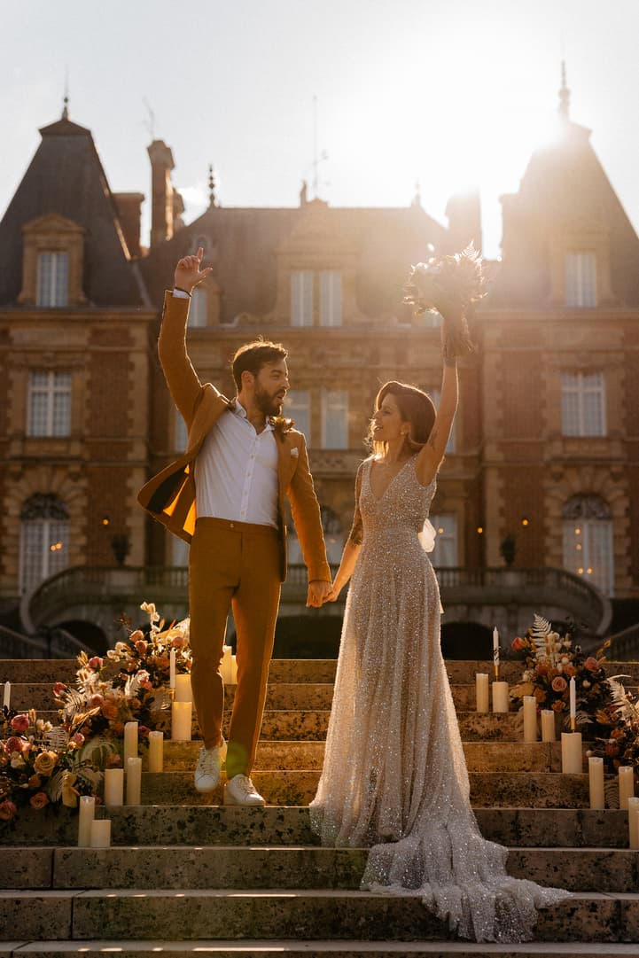 groom and bride celebrate their elopement castle wedding
