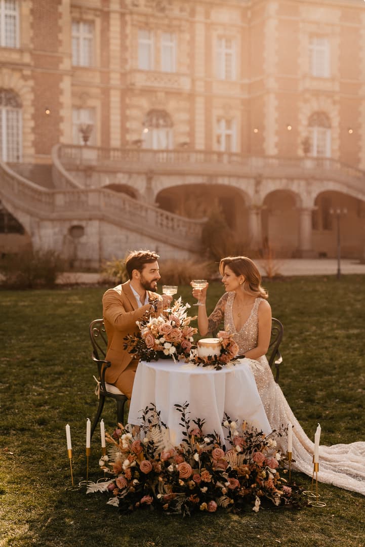 couple intimate wedding celebration with cake and champagne