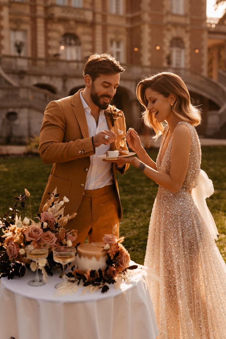 couple intimate wedding celebration with cake and champagne