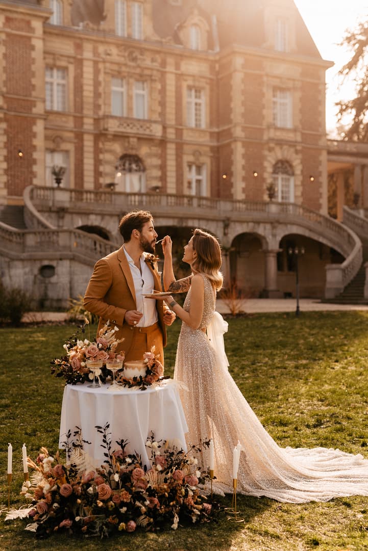 couple intimate wedding celebration with cake and champagne