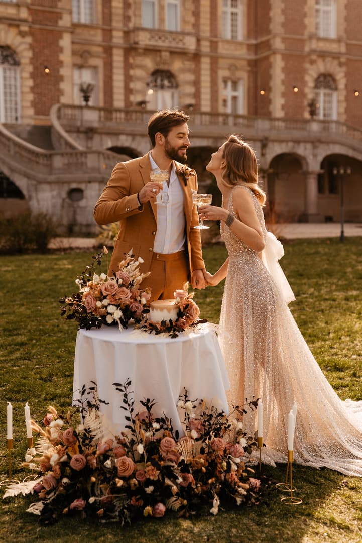 couple intimate wedding celebration with cake and champagne