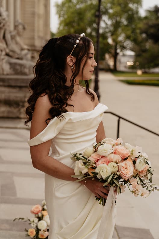 Beautiful bride with pink and white flower bouquet and House of CB Bridal Dress