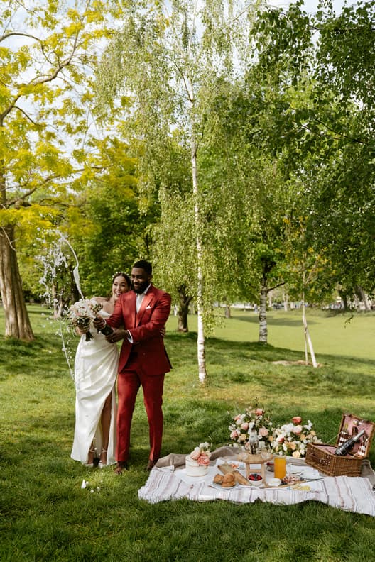 Popping champagne celebrations Picnic Wedding Reception intimate Couple elopement