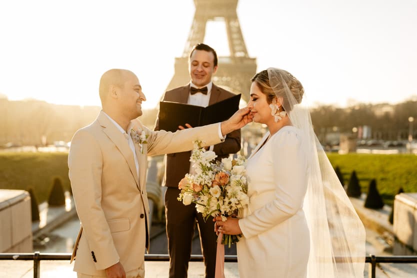 Paris Elopement Packages Elopement Photographer Videographer winter elopement couple ceremony Eiffel Tower view 
