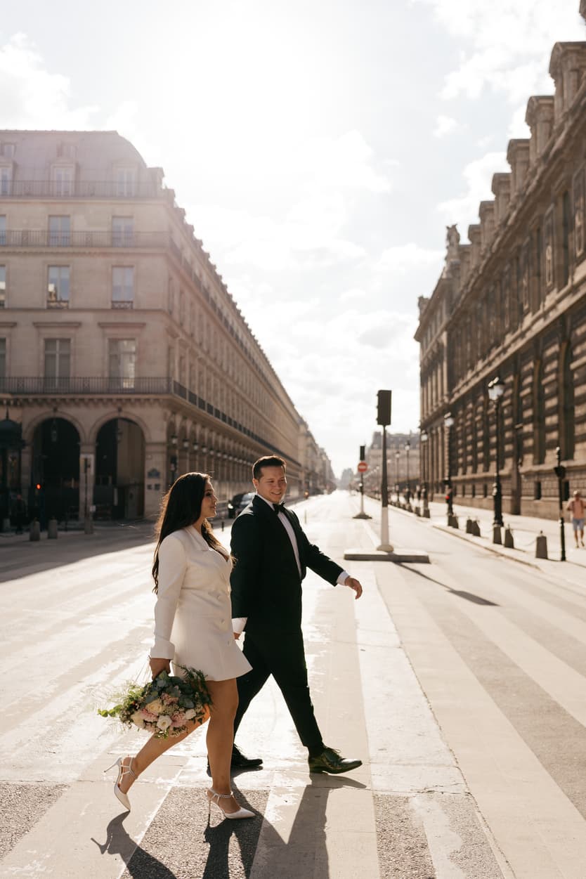 Paris Elopement Packages Elopement Photographer Videographer Louvre couple crossing 