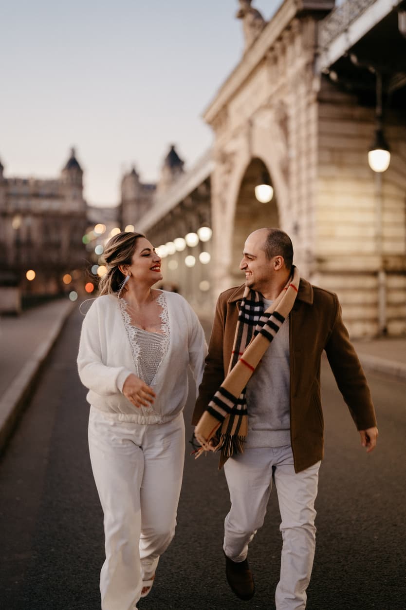 Paris Elopement Packages Elopement Photographer Videographer winter elopement couple running Bir Hakeim Paris 