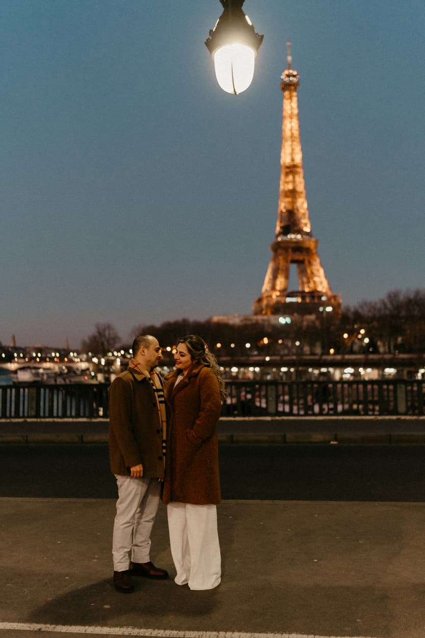 Paris Elopement Packages Elopement Photographer Videographer winter elopement couple Eiffel Tower view Bir Hakeim
