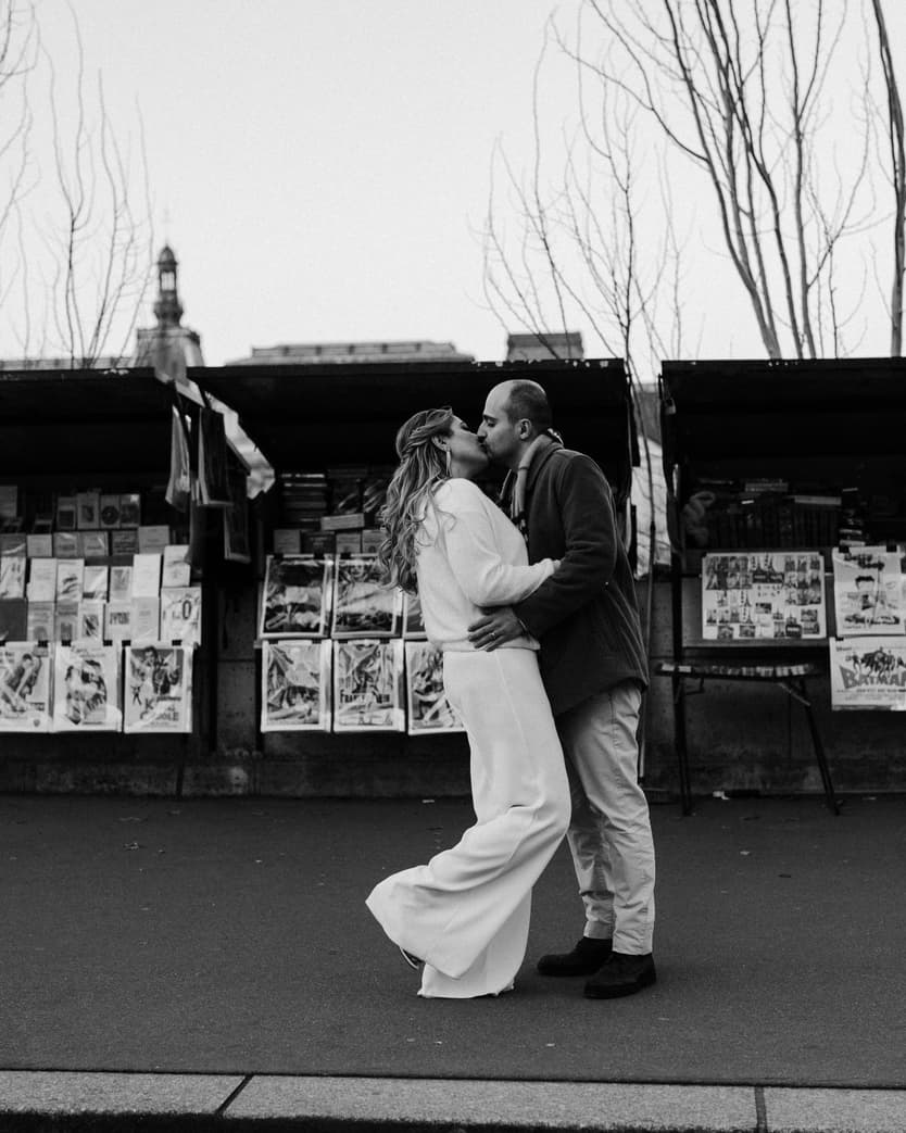 Paris Elopement Packages Elopement Photographer Videographer winter elopement couple kissing Louvre Paris 