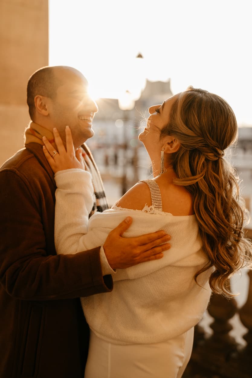 Paris Elopement Packages Elopement Photographer Videographer winter elopement couple laughing Louvre Paris 