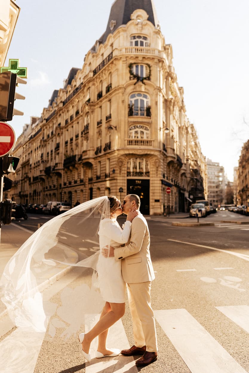 Paris Elopement Packages Elopement Photographer Videographer winter elopement couple in the street kissing Paris 