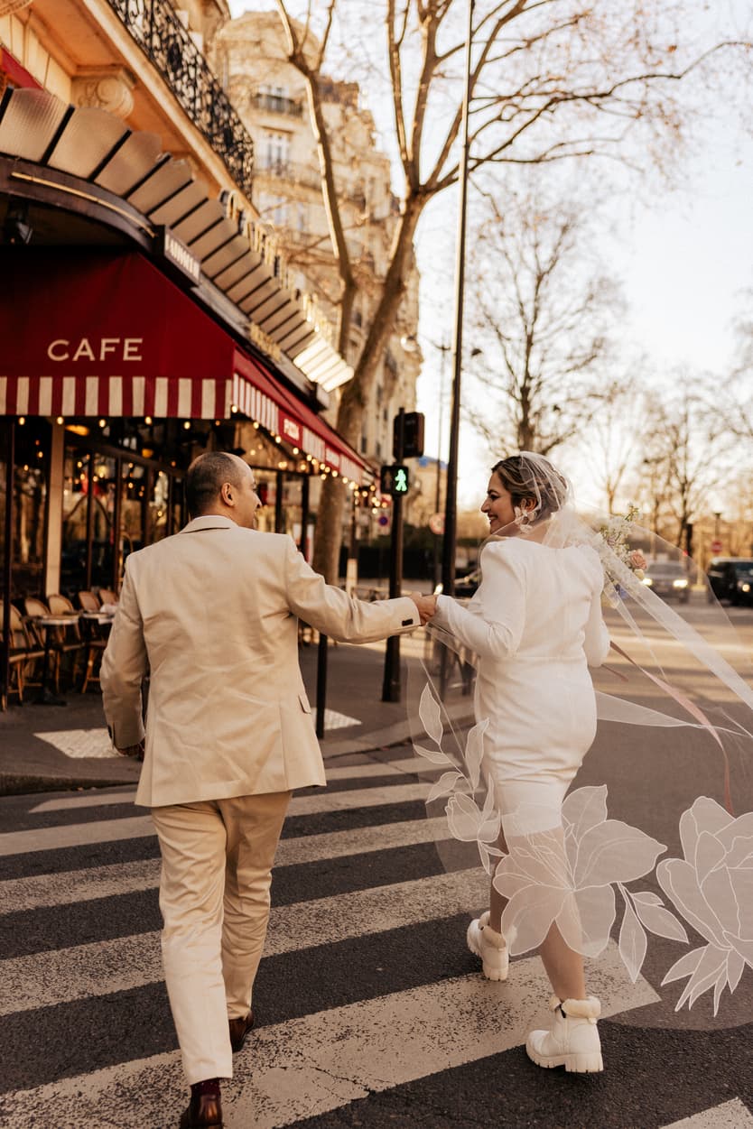 Paris Elopement Packages Elopement Photographer Videographer winter elopement couple crossing street Paris 