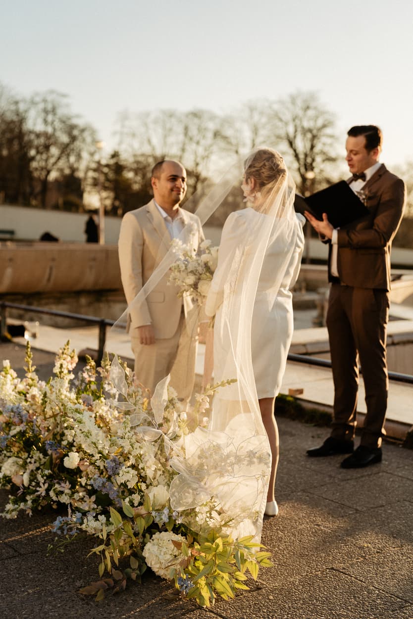 Paris Elopement Packages Elopement Photographer Videographer winter elopement couple ceremony flower decoration Eiffel Tower view 