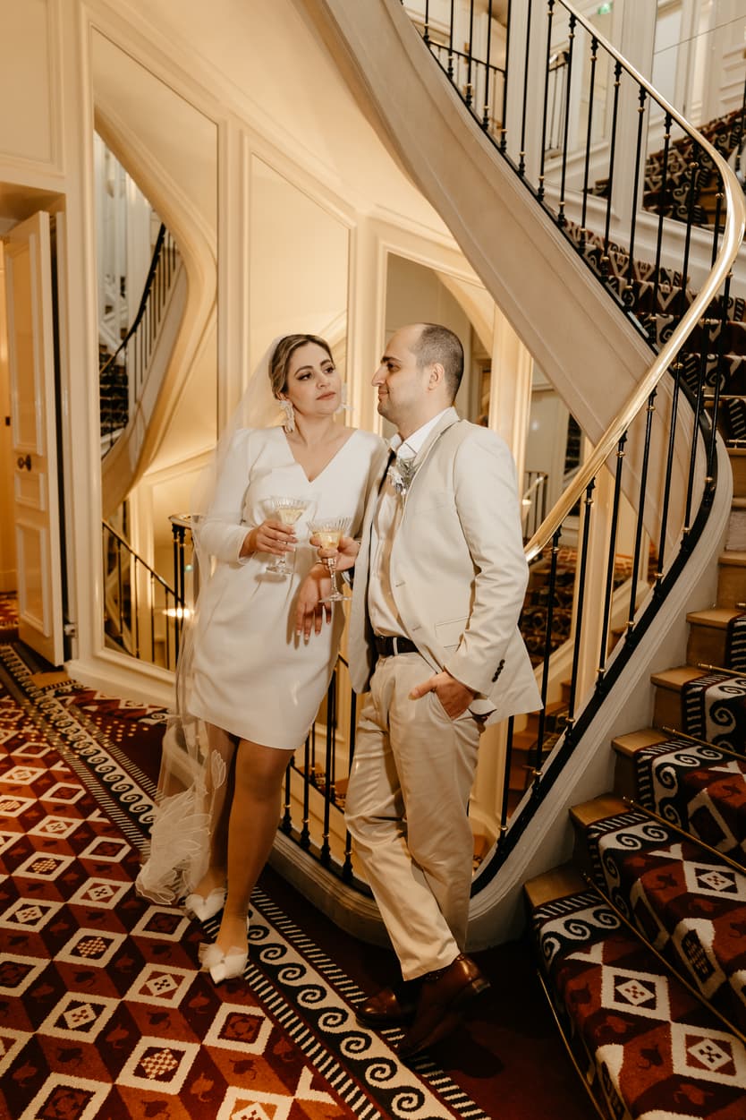 Paris Elopement Packages Elopement Photographer Videographer winter elopement couple at Saint James Paris stairs 
