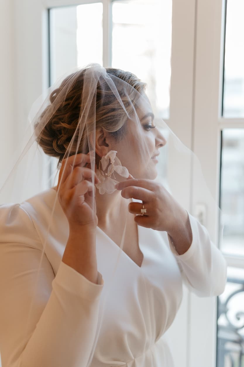 Paris Elopement Packages Elopement Photographer Videographer winter elopement bride with earings veil 