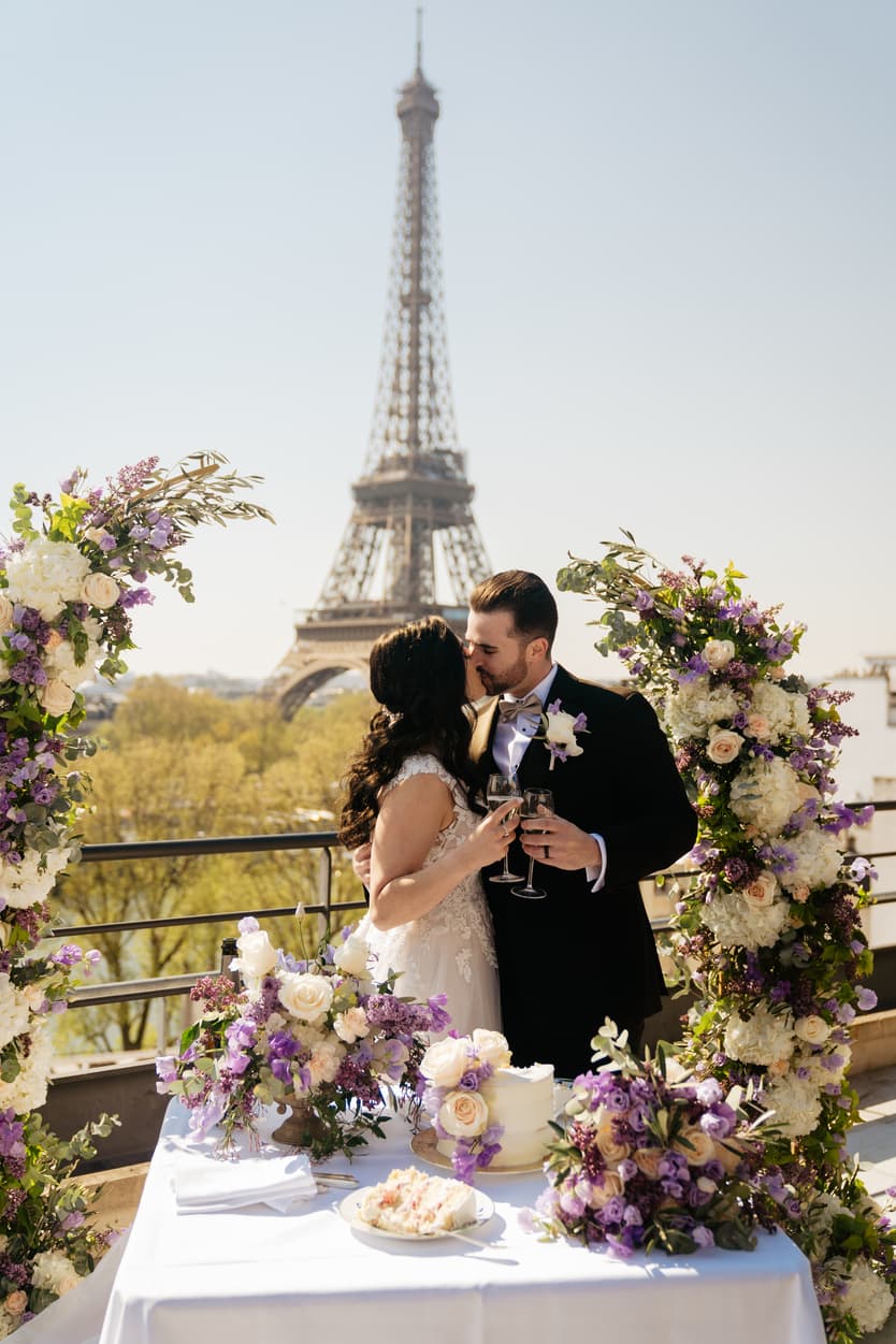 Destination Purple wedding elopement at Shangri-La Hotel Paris private rooftop Eiffel Tower view couple kissing