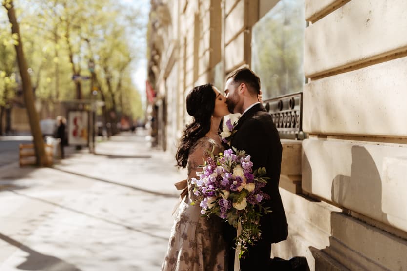 Destination Purple wedding elopement in Paris couple kissing 