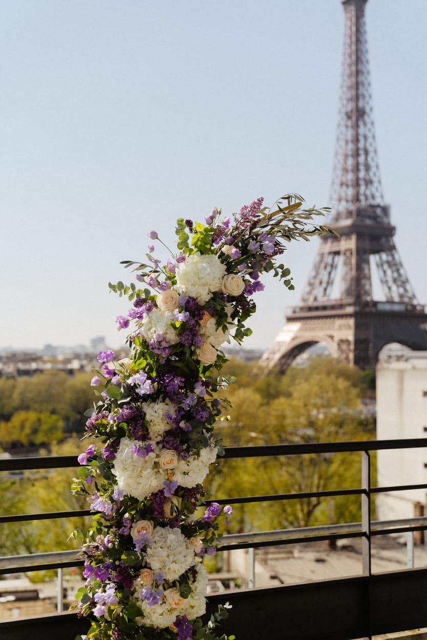 Destination Purple wedding elopement at Shangri-La Hotel Paris private rooftop Eiffel Tower view  floral arch 