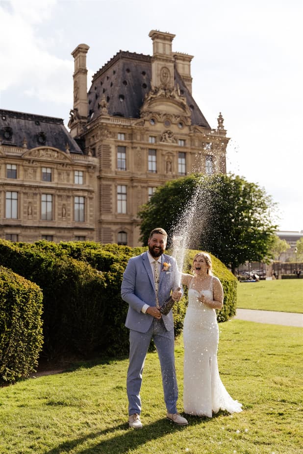 A&M celebrating with Champagne in the Louvre gardens