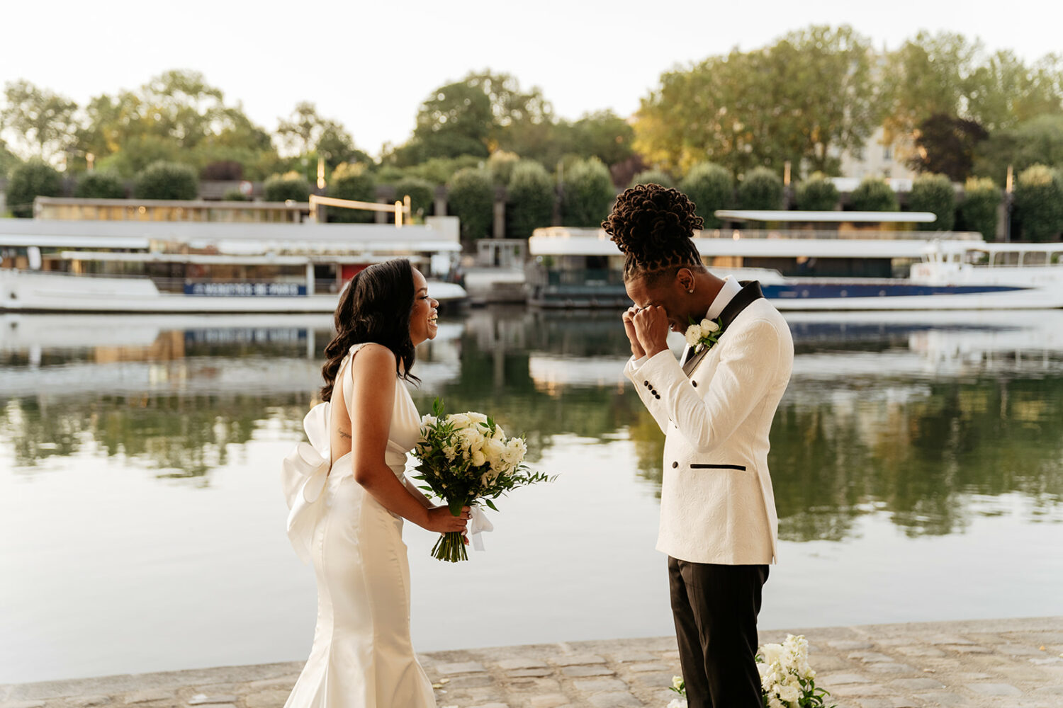paris elopement first look by the Seine river sunrise groom crying