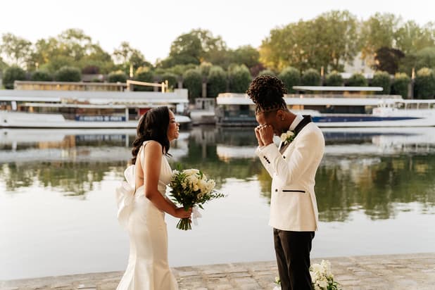 paris elopement first look by the Seine river sunrise groom crying