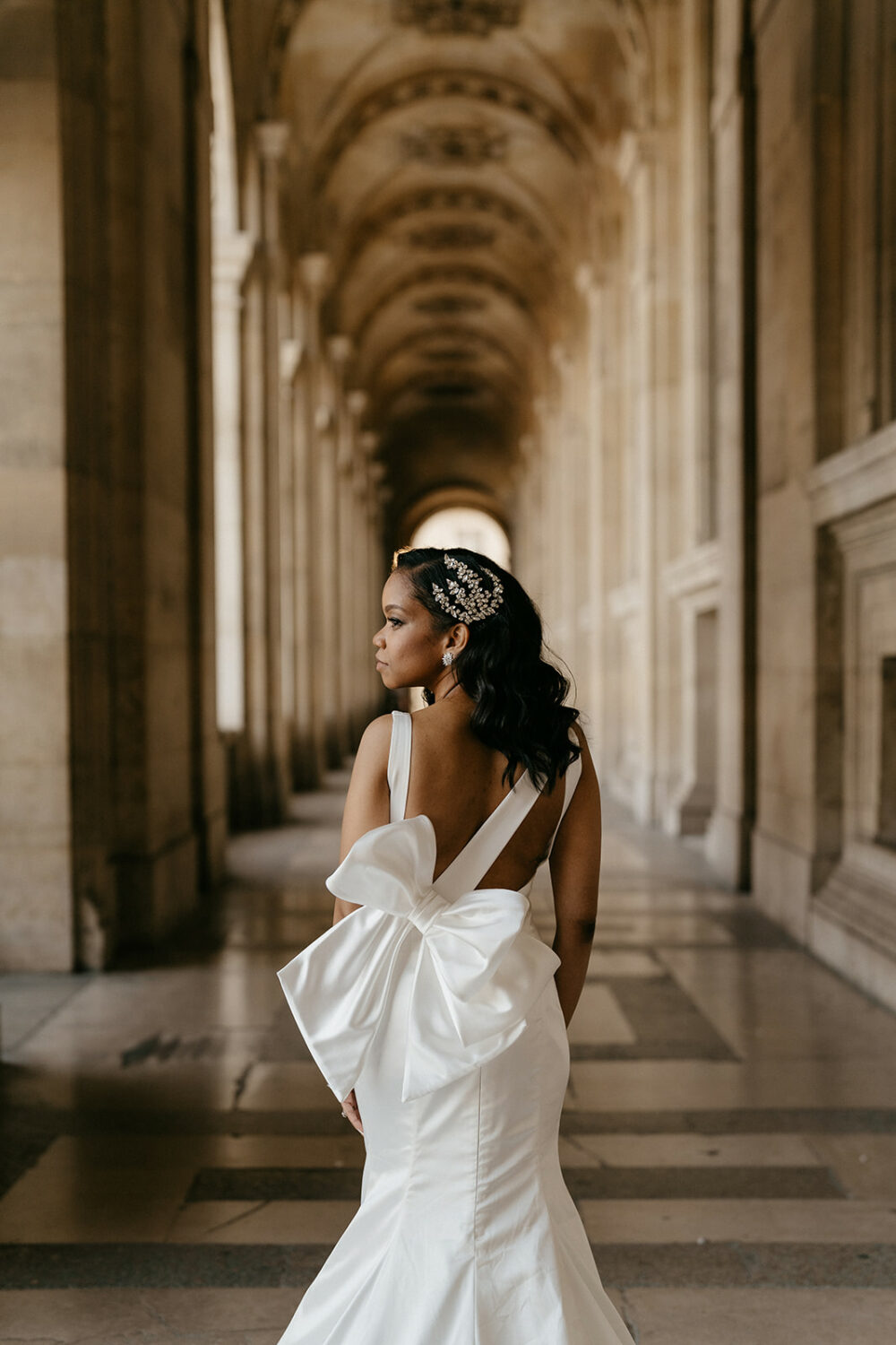 Bride wearing pnina Tornai dress with a statement bow for her elopement in Paris
