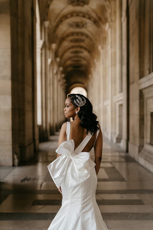 Bride wearing pnina Tornai dress with a statement bow for her elopement in Paris