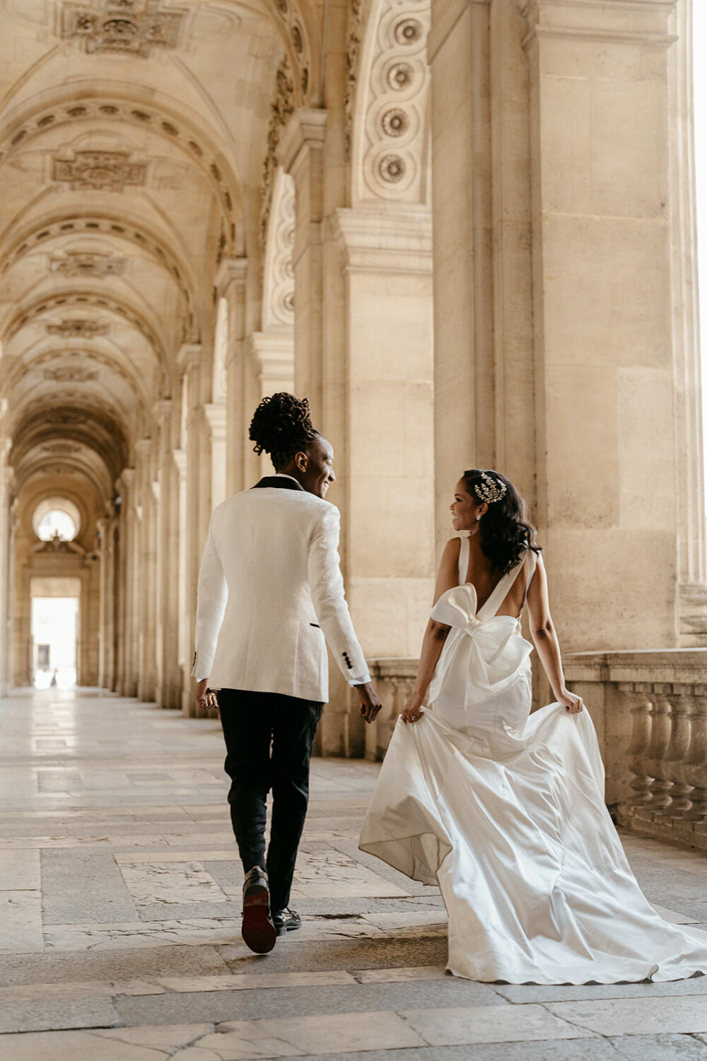 Paris elopement couple walking at the Louvre museum