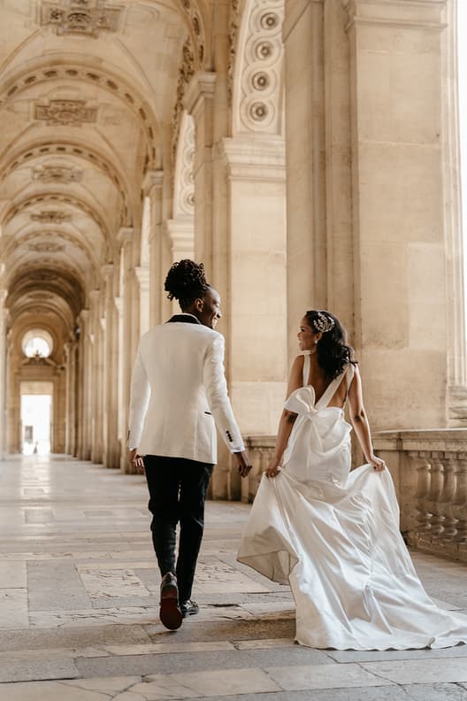 Paris elopement couple walking at the Louvre museum
