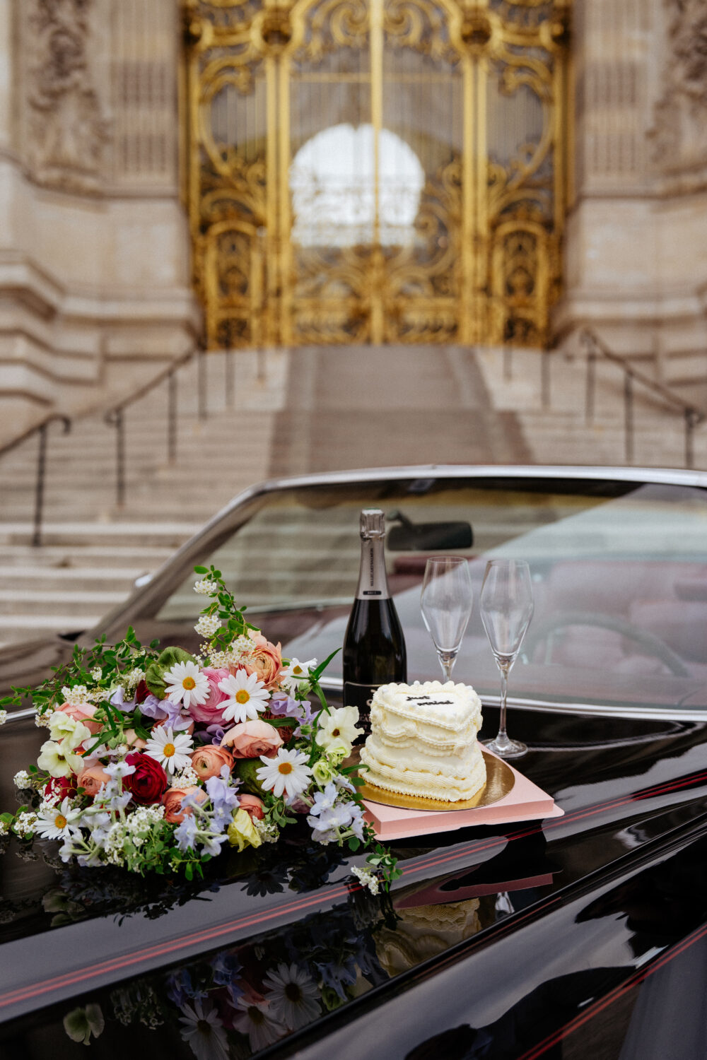 Colorful wedding bouquet vintage car cake champagne