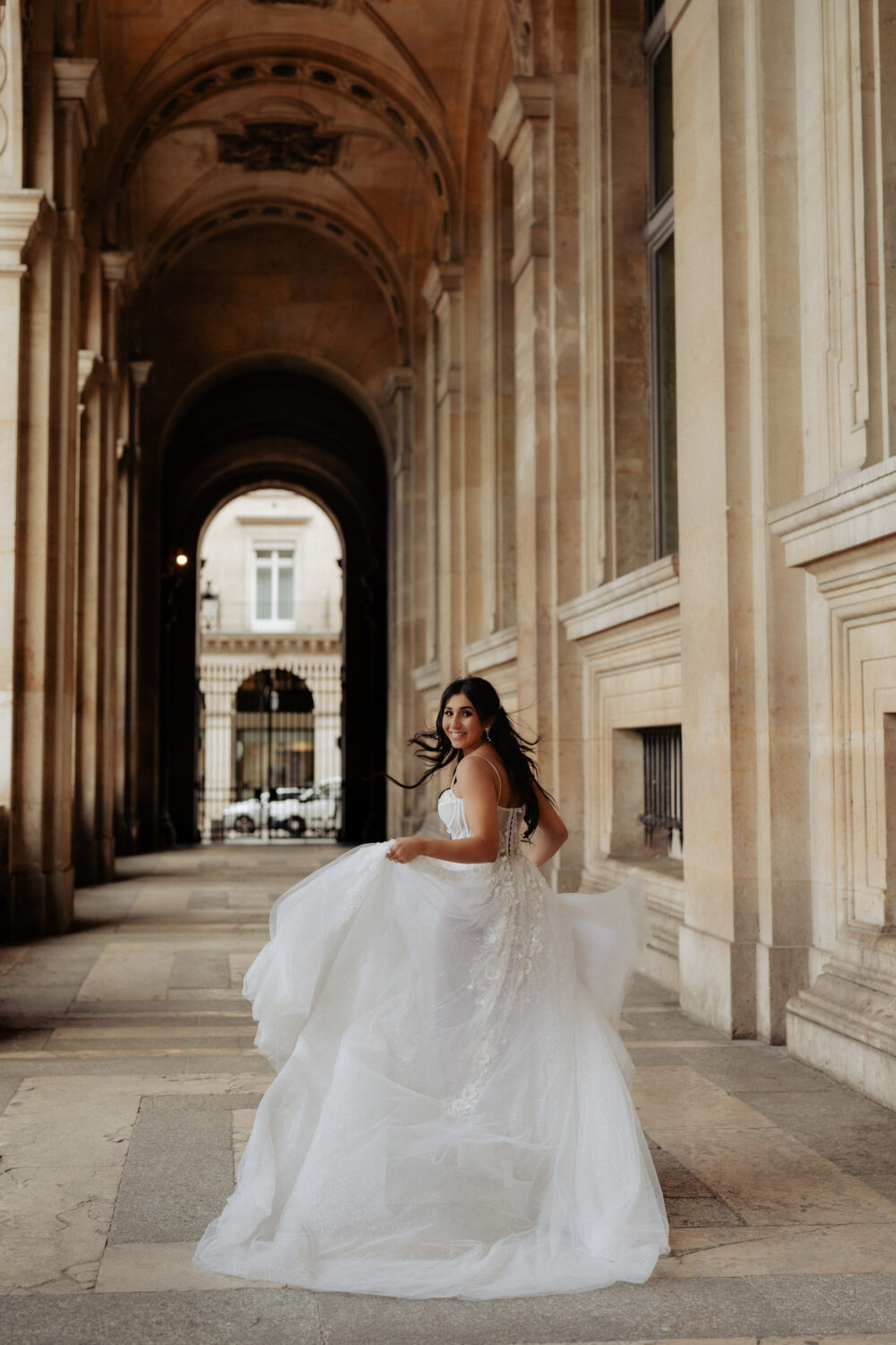 Bride running Paris elopement Louvre