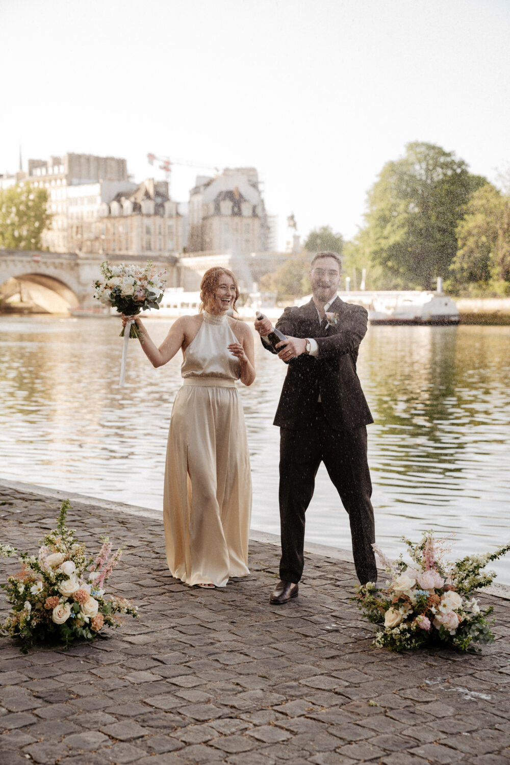spring paris elopement pont neuf champagne popping