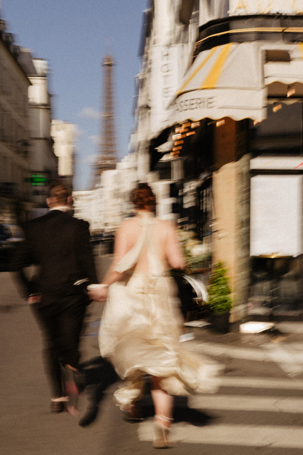 spring paris elopement eiffel tower view couple walking on street
