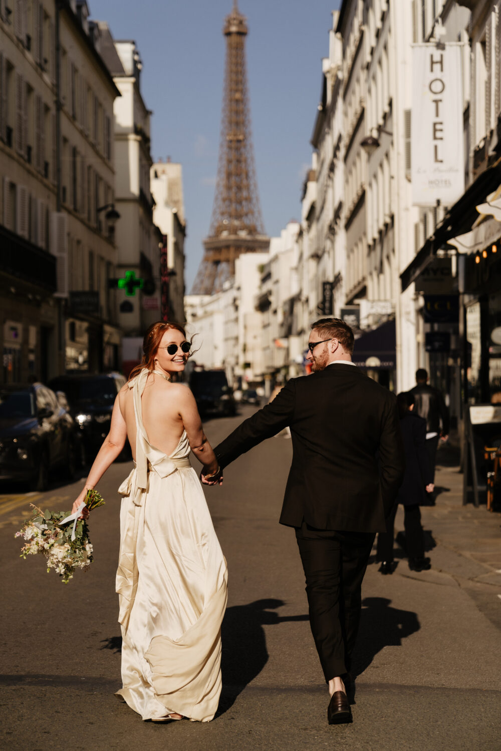 spring paris elopement eiffel tower view couple walking on street