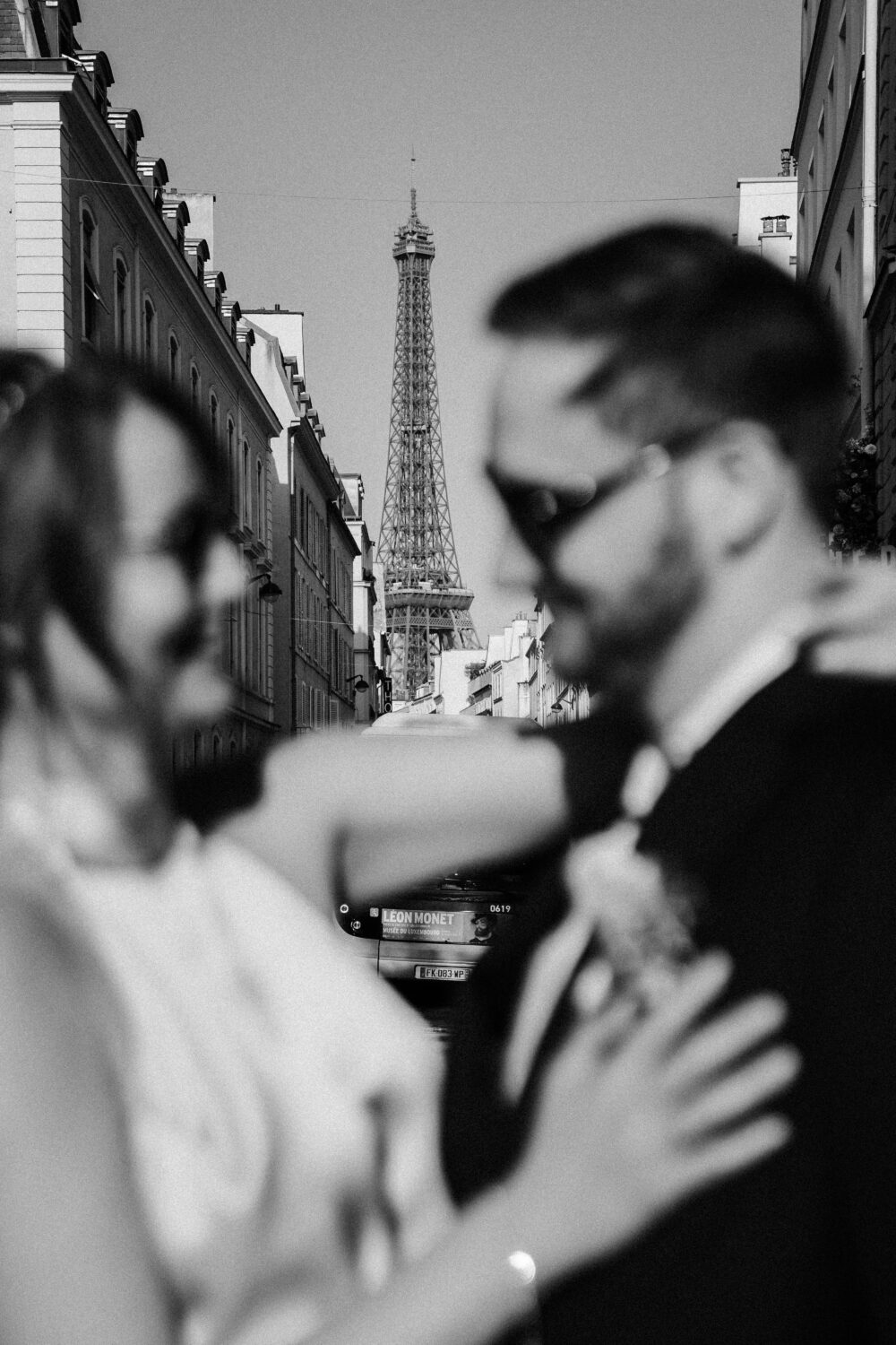 spring elopement eiffel tower view couple looking at each other