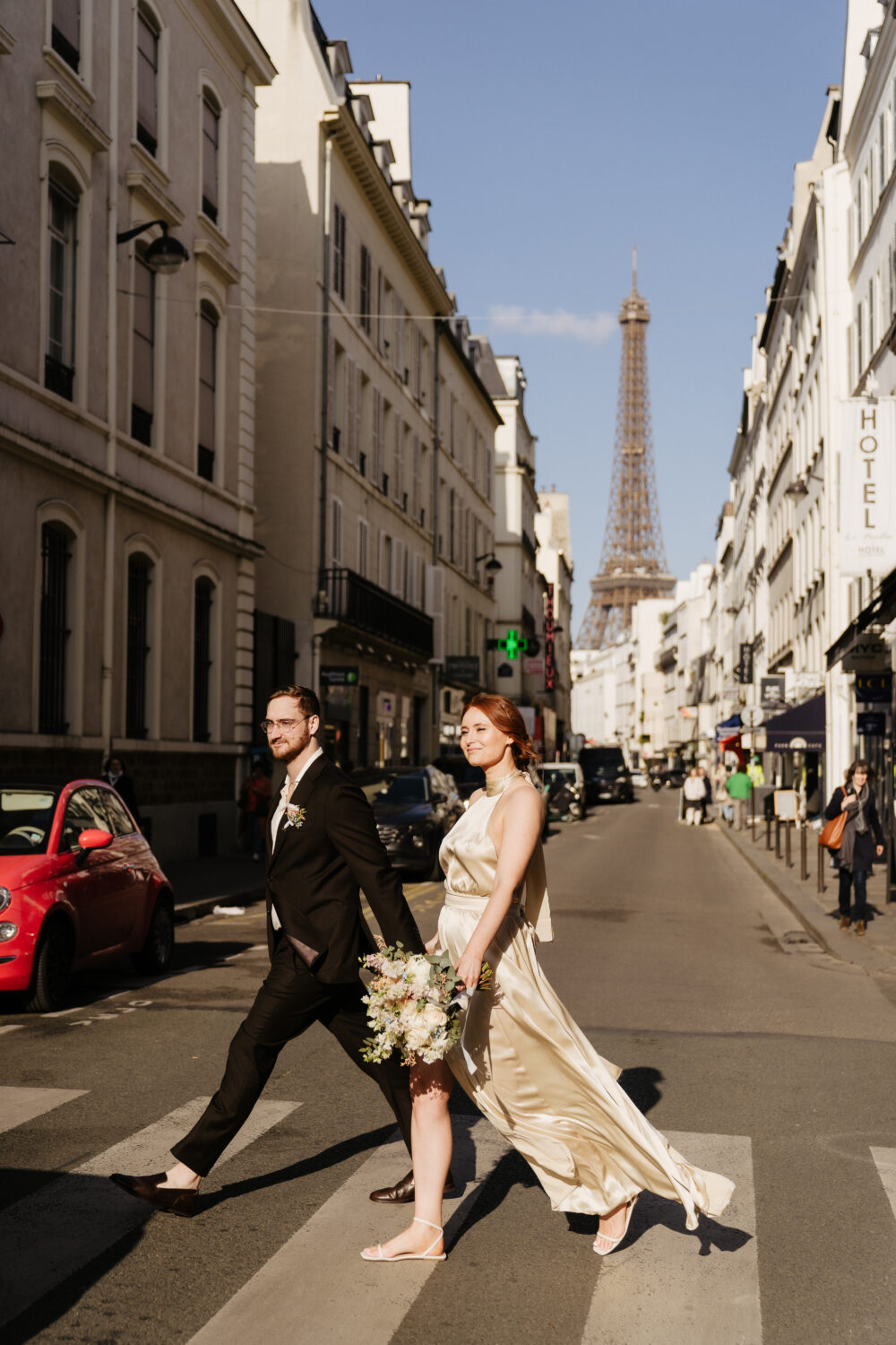 spring paris elopement eiffel tower view couple walking on street