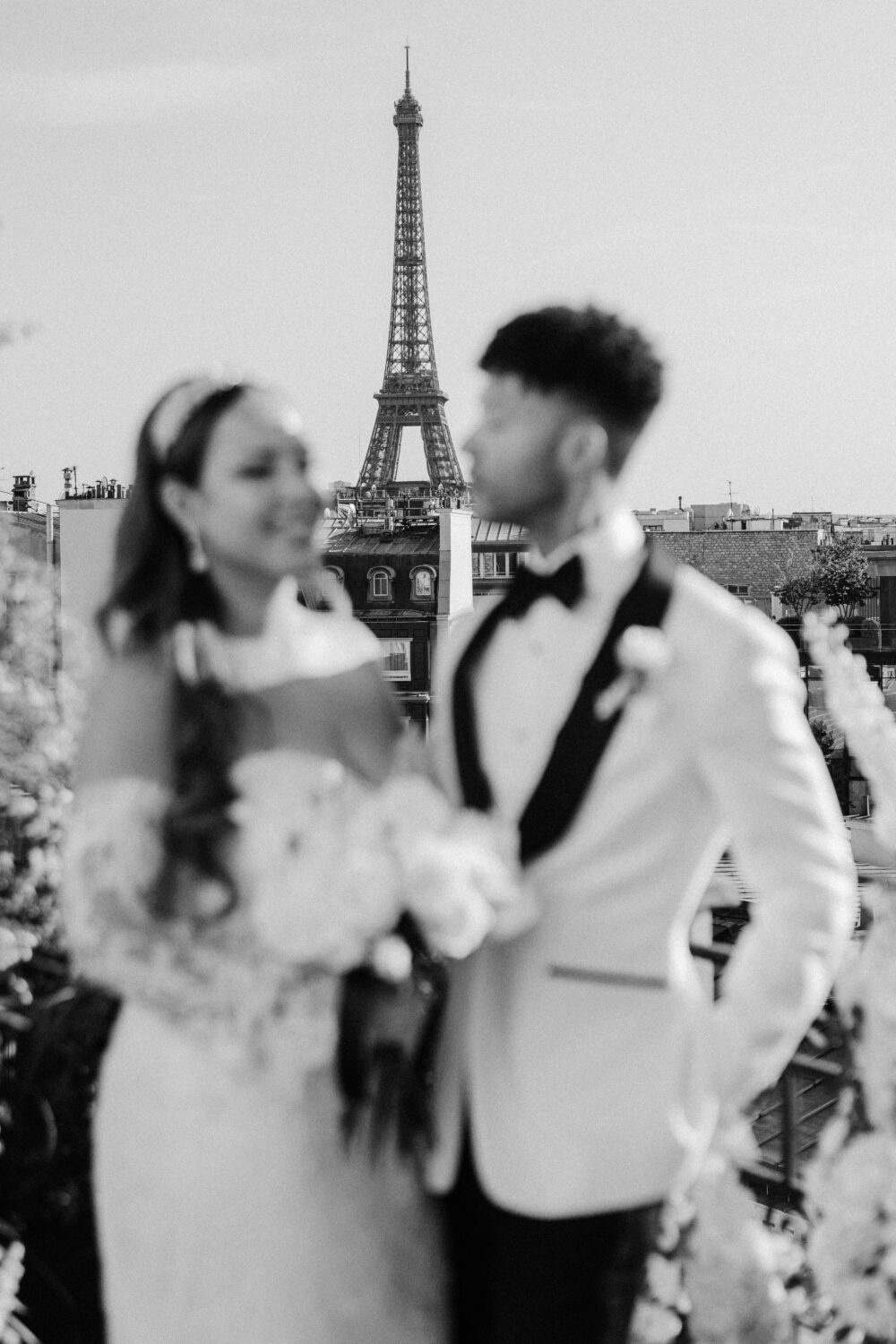 couple portrait at terrace with eiffel tower paris marignan hotel