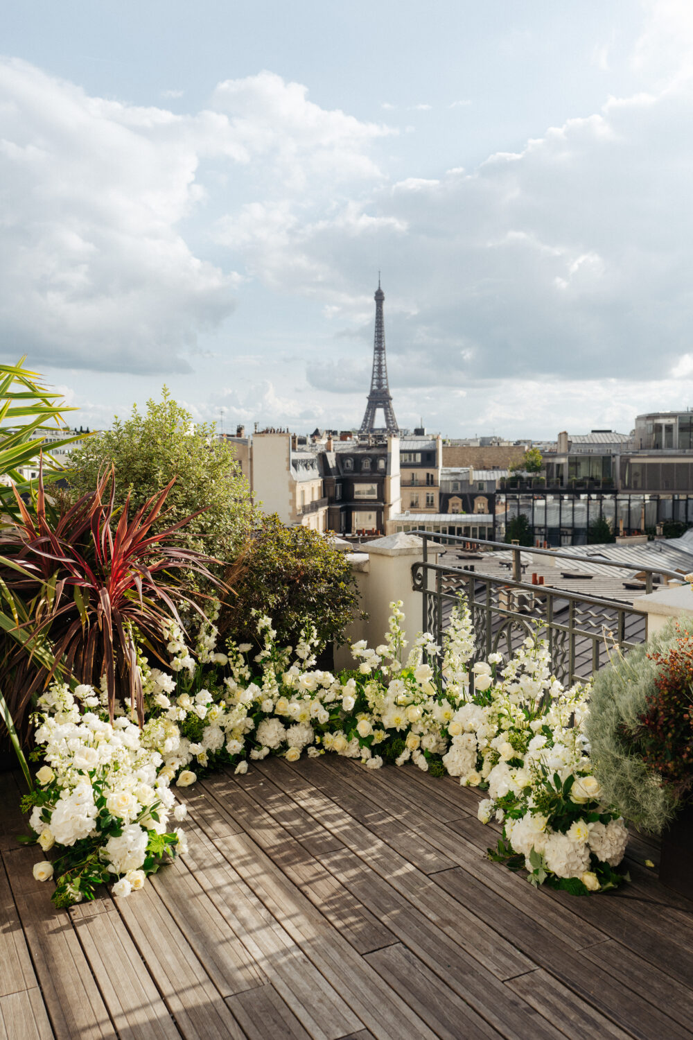 Paris rooftop elopement flower arrangement at Hotel Marignan with eiffel tower view