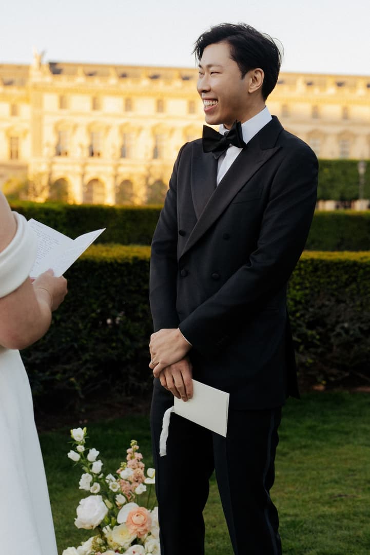 Jason smiling as he listens to Nancy's wedding vows in Paris