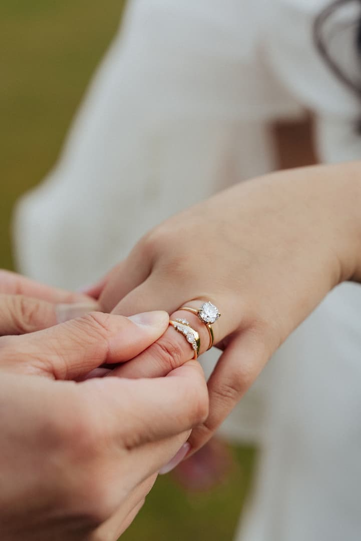 Close-up of the wedding ring exchange at a Paris elopement