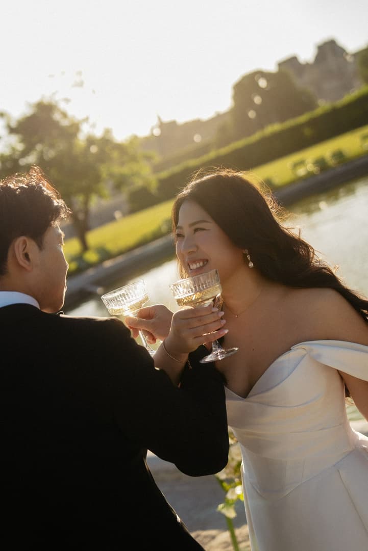 Nancy laughing as she toasts with Jason in the Tuileries garden