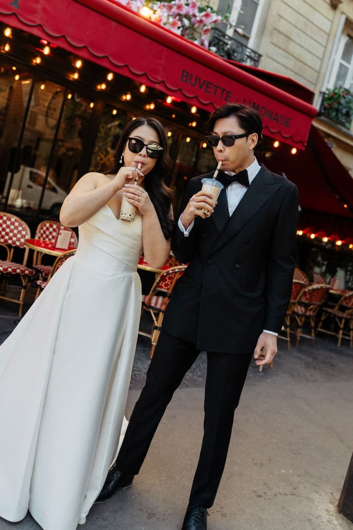 Nancy and Jason drinking bubble tea outside a Paris café