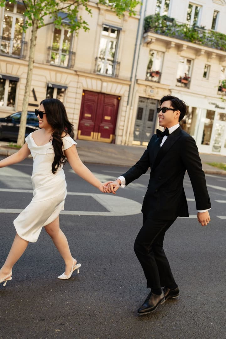 Nancy and Jason crossing a Paris street hand in hand