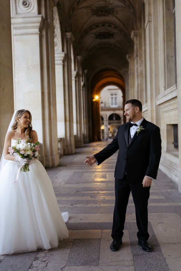 Aphrodite reaching for Michael's hand during their first look at the Louvre