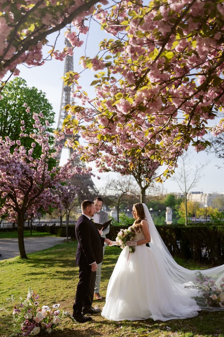 Aphrodite and Michael's ceremony under the cherry blossoms with the Eiffel Tower